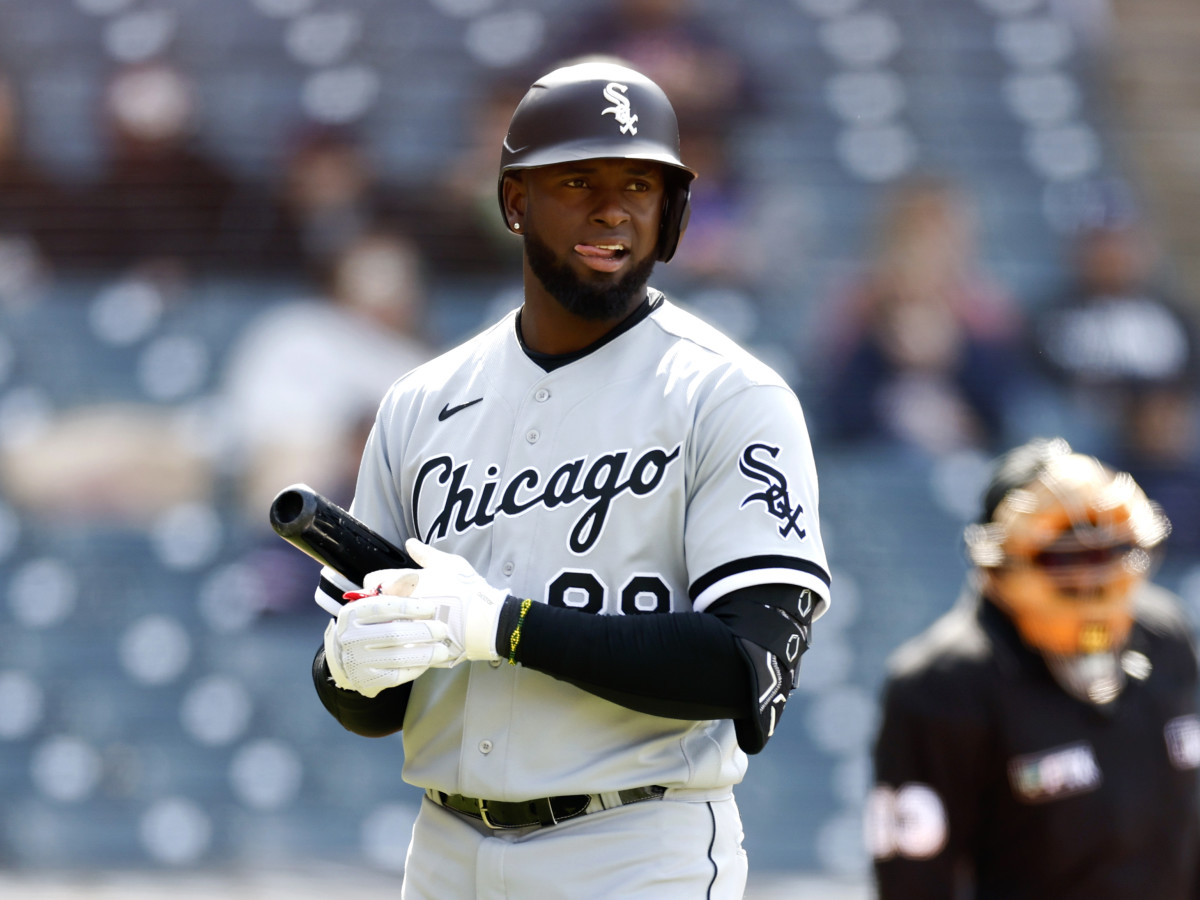 Chicago White Sox’s Luis Robert reacts after striking out against the Cleveland Guardians during the sixth inning in the first game of a baseball doubleheader, Wednesday, April 20, 2022, in Cleveland.