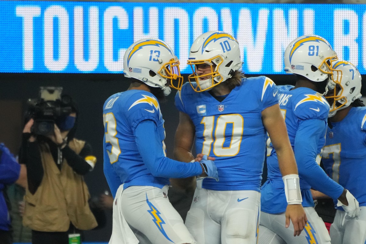 Dec 16, 2021; Inglewood, California, USA; Los Angeles Chargers wide receiver Keenan Allen (13) and quarterback Justin Herbert (10) celebrate after a touchdown against the Kansas City Chiefs in the second half at SoFi Stadium. Mandatory Credit: Kirby Lee-USA TODAY Sports