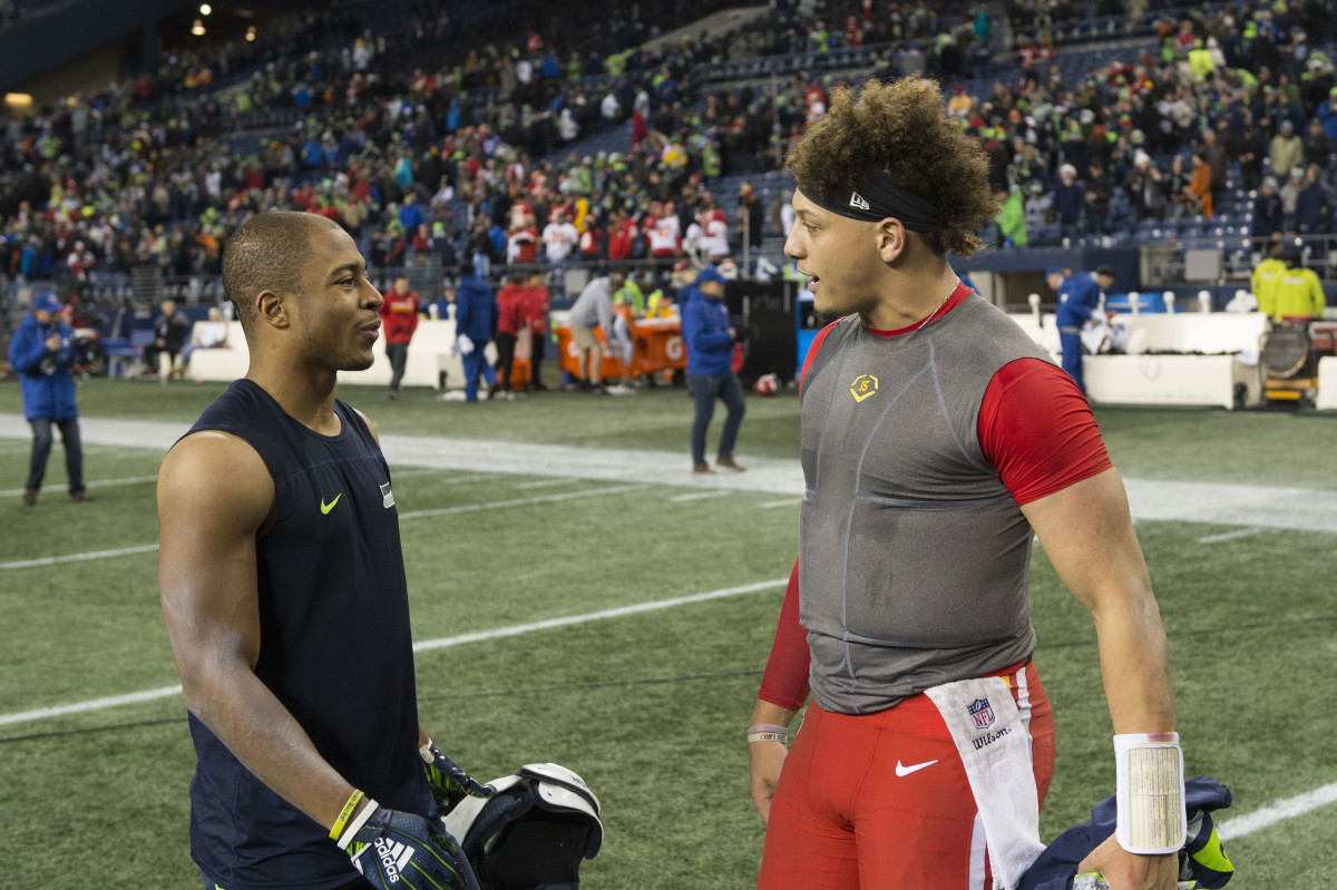 Dec 23, 2018; Seattle, WA, USA; Seattle Seahawks wide receiver Tyler Lockett (16) and Kansas City Chiefs quarterback Patrick Mahomes (15) talk after the game at CenturyLink Field. Seattle defeated Kansas City 38-31. Mandatory Credit: Steven Bisig-USA TODAY Sports