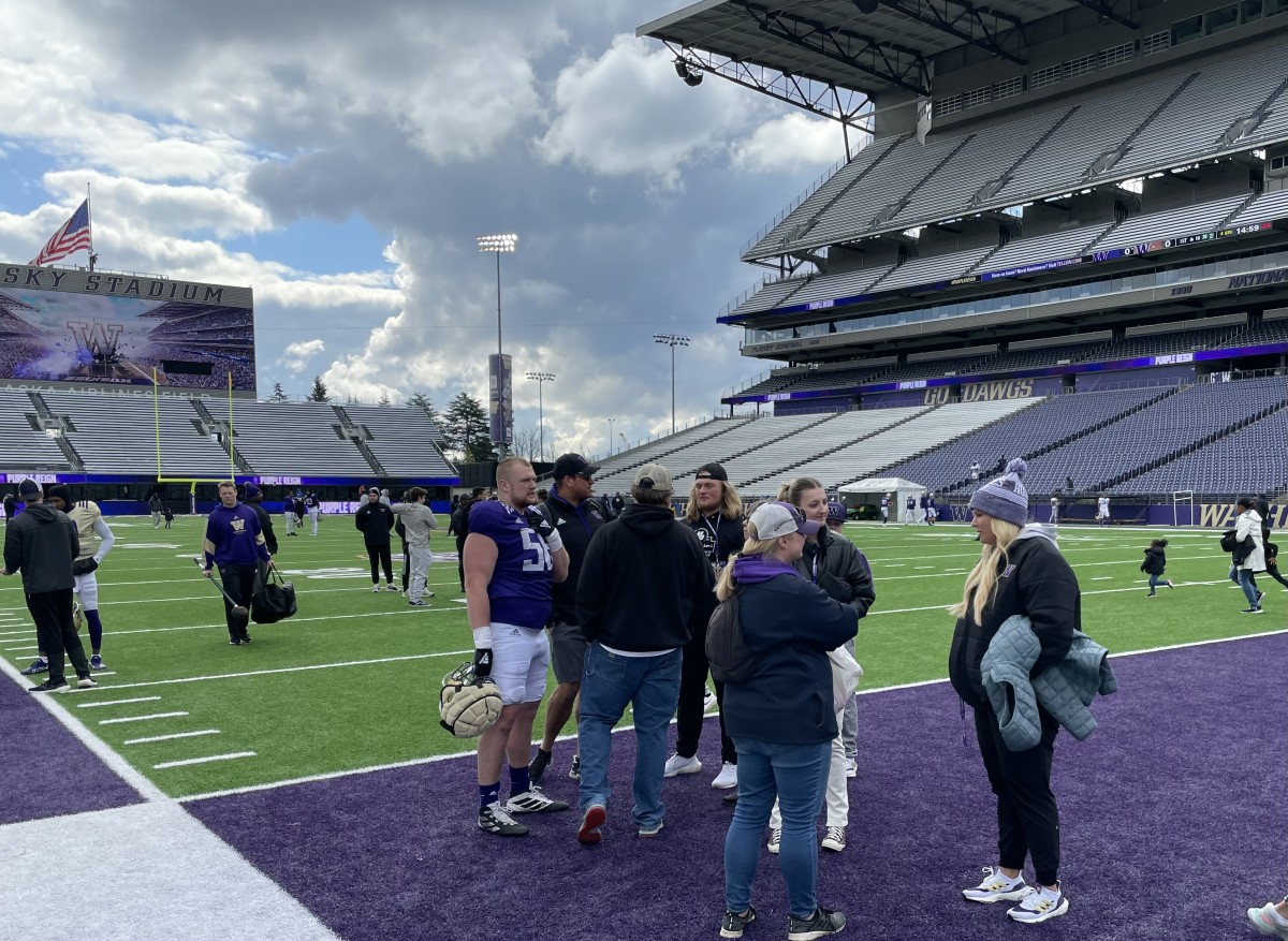 Landon Hatchett, with long-flowing hair, was a regular visitor to UW spring practice.