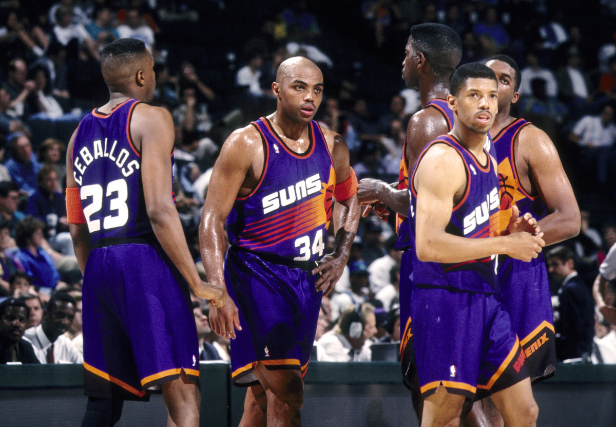 Phoenix Suns forward Charles Barkley (34), Cedric Ceballos (23), Kevin Johnson (7), Oliver Miller and A.C. Green wait during a time-out against the Dallas Mavericks at Reunion Arena during the 1993-94 season.