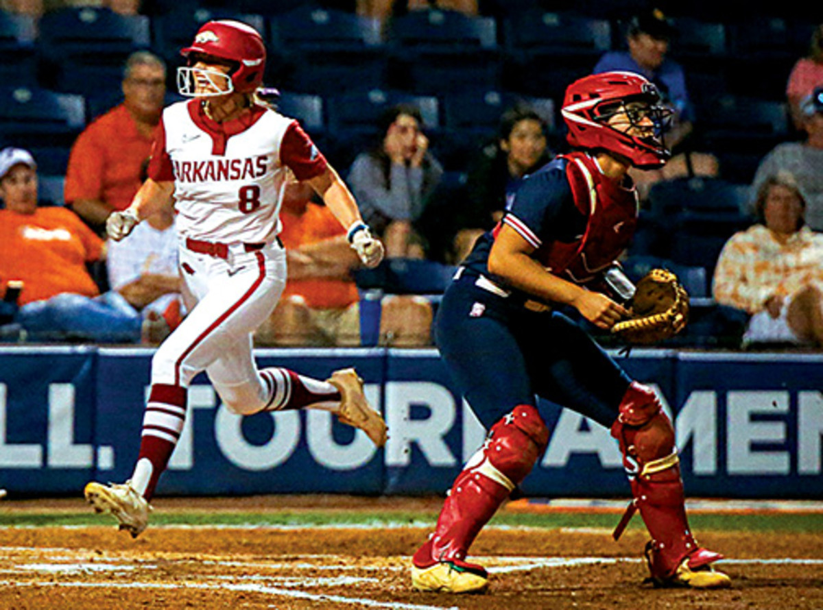 Arkansas Razorbacks outfielder KB Sides (8) runs home off of catcher Taylor Ellsworth's (17) RBI double during the game against the Ole Miss Rebels at Katie Seashole Pressly Stadium at the University of Florida Thursday.