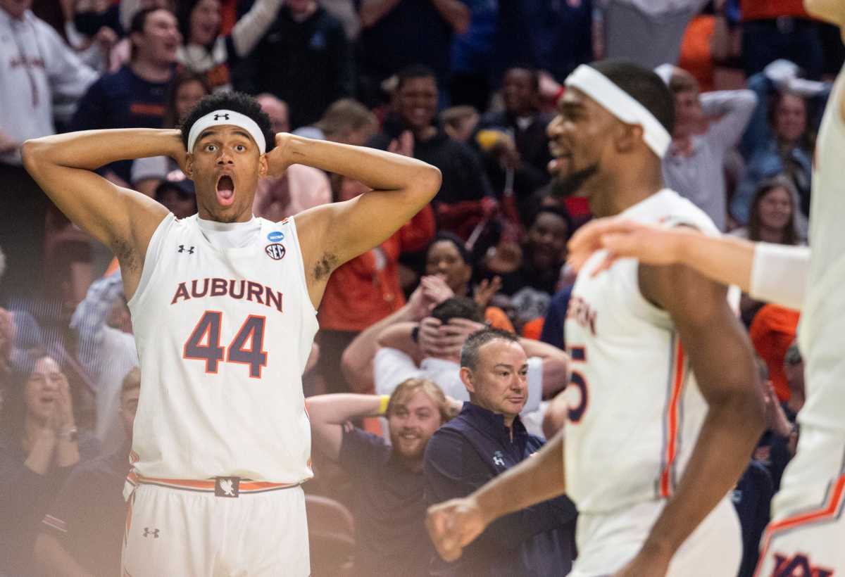 Auburn Tigers center Dylan Cardwell (44) reacts to a Jabari Smith dunk during the first round of the 2022 NCAA tournament at Bon Secours Wellness Arena in Greenville, S.C., on Friday, March 18, 2022. Auburn Tigers defeated Jacksonville State Gamecocks 80-61.
