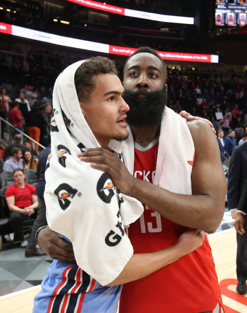 Mar 19, 2019; Atlanta, GA, USA; Atlanta Hawks guard Trae Young (11) greets Houston Rockets guard James Harden (13) after a game at State Farm Arena.