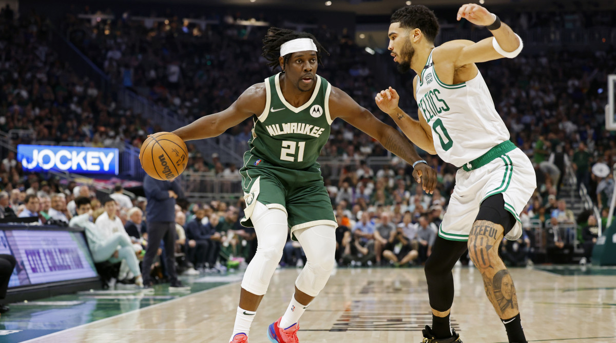 Milwaukee Bucks guard Jrue Holiday (21) drives for the basket as Boston Celtics forward Jayson Tatum (0) defends during the second quarter during game six of the second round for the 2022 NBA playoffs at Fiserv Forum.