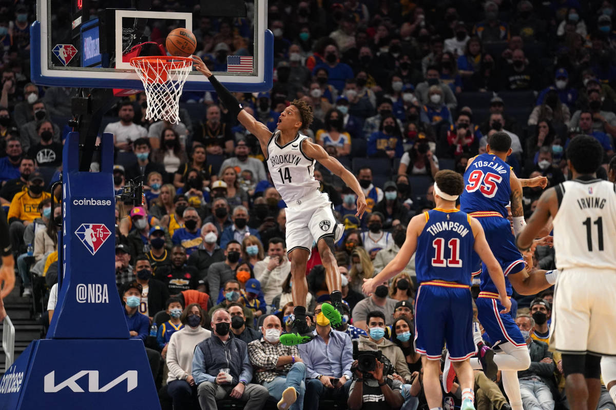 Brooklyn Nets forward Kessler Edwards (14) misses a dunk attempt against the Golden State Warriors in the second quarter at the Chase Center.
