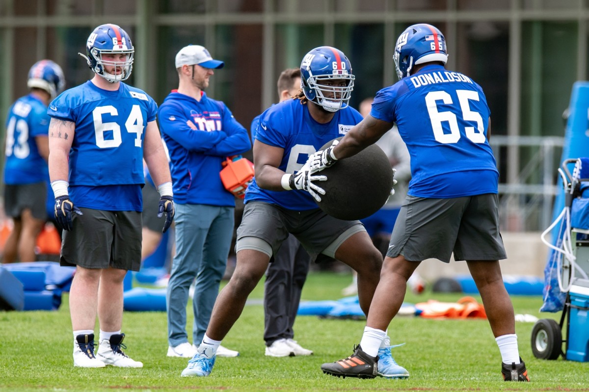 May 13, 2022; East Rutherford, NJ, USA; New York Giants offensive lineman Marcus McKethan (60) practices a drill during rookie camp at Quest Diagnostics Training Center.