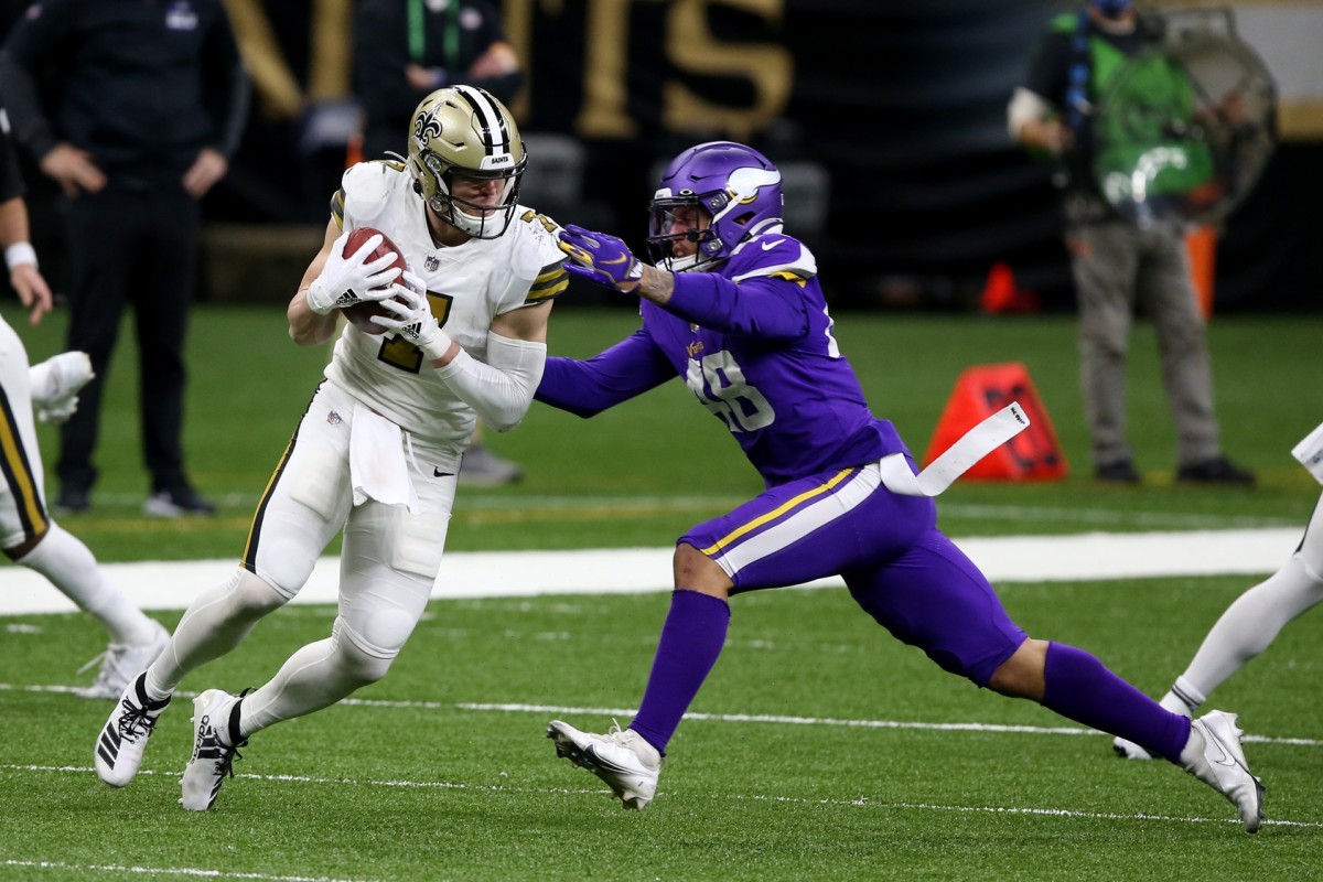 New Orleans Saints Taysom Hill (7) runs after a catch while defended by Minnesota Vikings linebacker Blake Lynch (48). Mandatory Credit: Chuck Cook-USA TODAY Sports