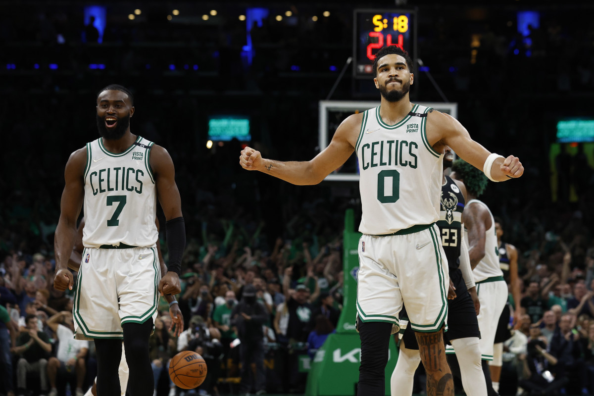 Celtics guard Jaylen Brown (7) and forward Jayson Tatum (0) celebrate during the second half of their win over the Bucks in Game 7 of the second round of the 2022 NBA playoffs at TD Garden