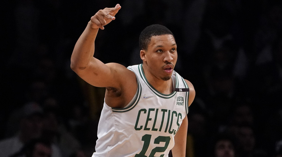 Celtics forward Grant Williams (12) reacts after scoring three points during the first half of Game 4 of an NBA basketball first-round playoff series against the Brooklyn Nets, Monday, April 25, 2022, in New York.