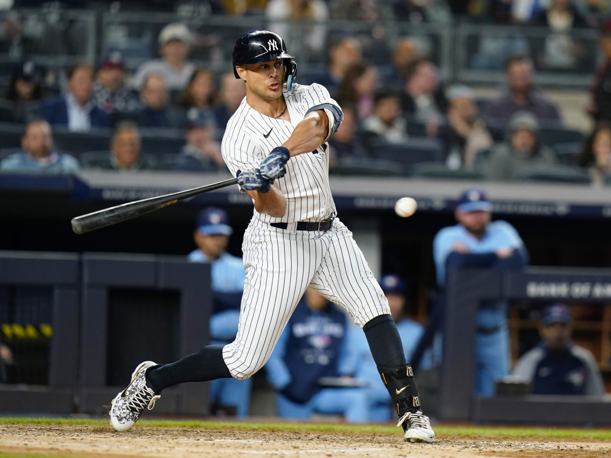 New York Yankees’ Giancarlo Stanton hits a three-run home run during the sixth inning of a baseball game against the Toronto Blue Jays, Tuesday, May 10, 2022, in New York.