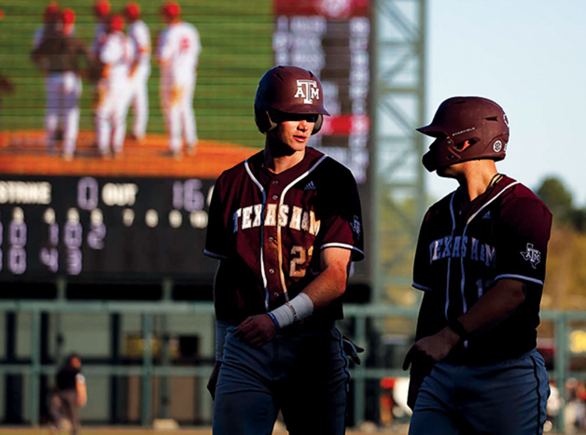 Texas A&M hitters talk things out during a potential pitching change during a series at Alabama. The Aggies have drawn national attention for canceling a game against Incarnate World this week because manager Jim Schlossnagle said he didn't want to hurt his team's RPI.