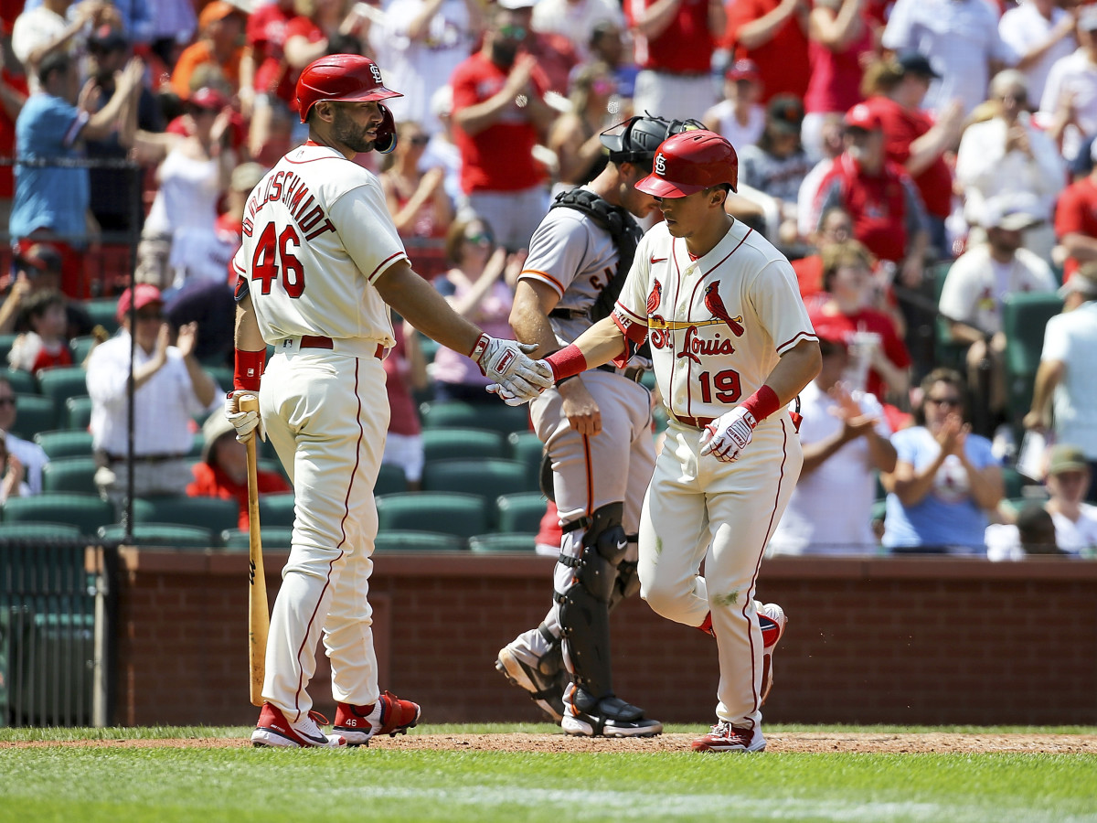 St. Louis Cardinals’ Paul Goldschmidt, left, congratulates Tommy Edman as he crosses home plate after hitting a solo home run during the fifth inning of a baseball game against the San Francisco Giants, Saturday, May 14, 2022, in St. Louis.