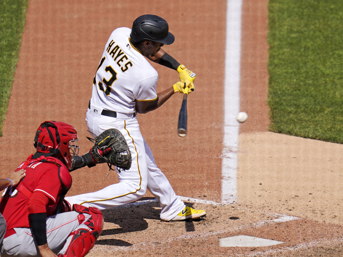 Pittsburgh Pirates’ Ke’Bryan Hayes (13) hits into a fielder’s choice off Cincinnati Reds relief pitcher Art Warren(not shown), driving in a baseball game’s only run, during the eighth inning in Pittsburgh, Sunday, May 15, 2022.