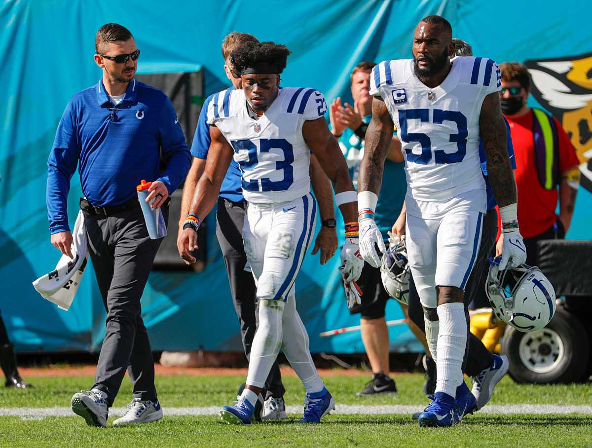Indianapolis Colts outside linebacker Darius Leonard (53) (right) walks with cornerback Kenny Moore II (23) (center) after Moore II was injured during the first quarter of the game Sunday, Jan. 9, 2022, at TIAA Bank Field in Jacksonville, Fla. The Indianapolis Colts Versus Jacksonville Jaguars On Sunday Jan 9 2022 Tiaa Bank Field In Jacksonville Fla