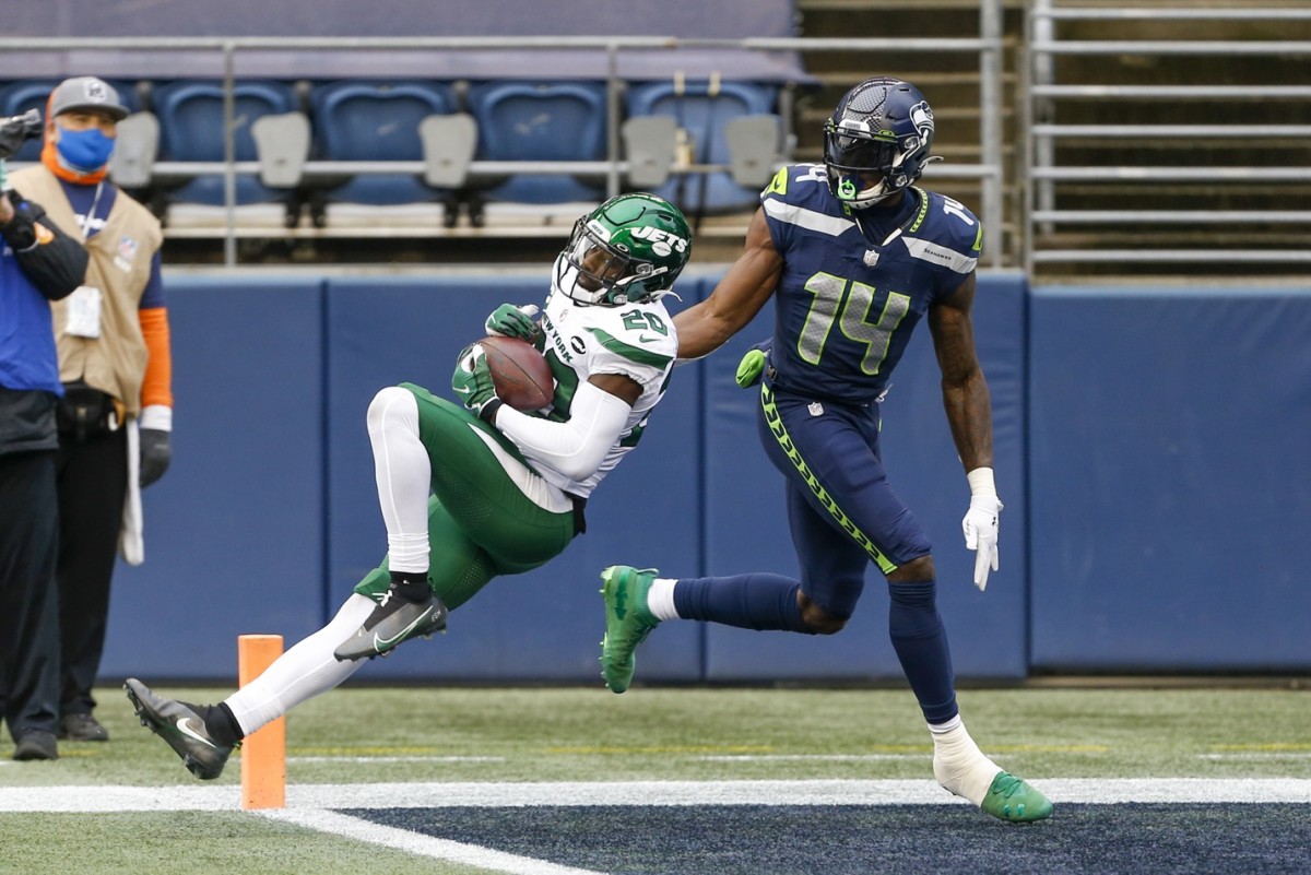 Former New York Jets safety Marcus Maye (20) intercepts a pass intended for Seattle receiver DK Metcalf (14). Mandatory Credit: Joe Nicholson-USA TODAY Sports