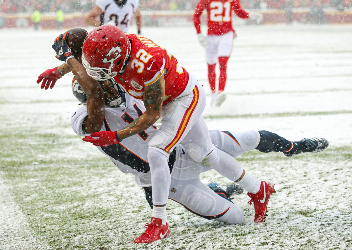 Former Chiefs safety Tyrann Mathieu (32) breaks up a pass intended for Broncos receiver Courtland Sutton (14). Mandatory Credit: Jay Biggerstaff-USA TODAY