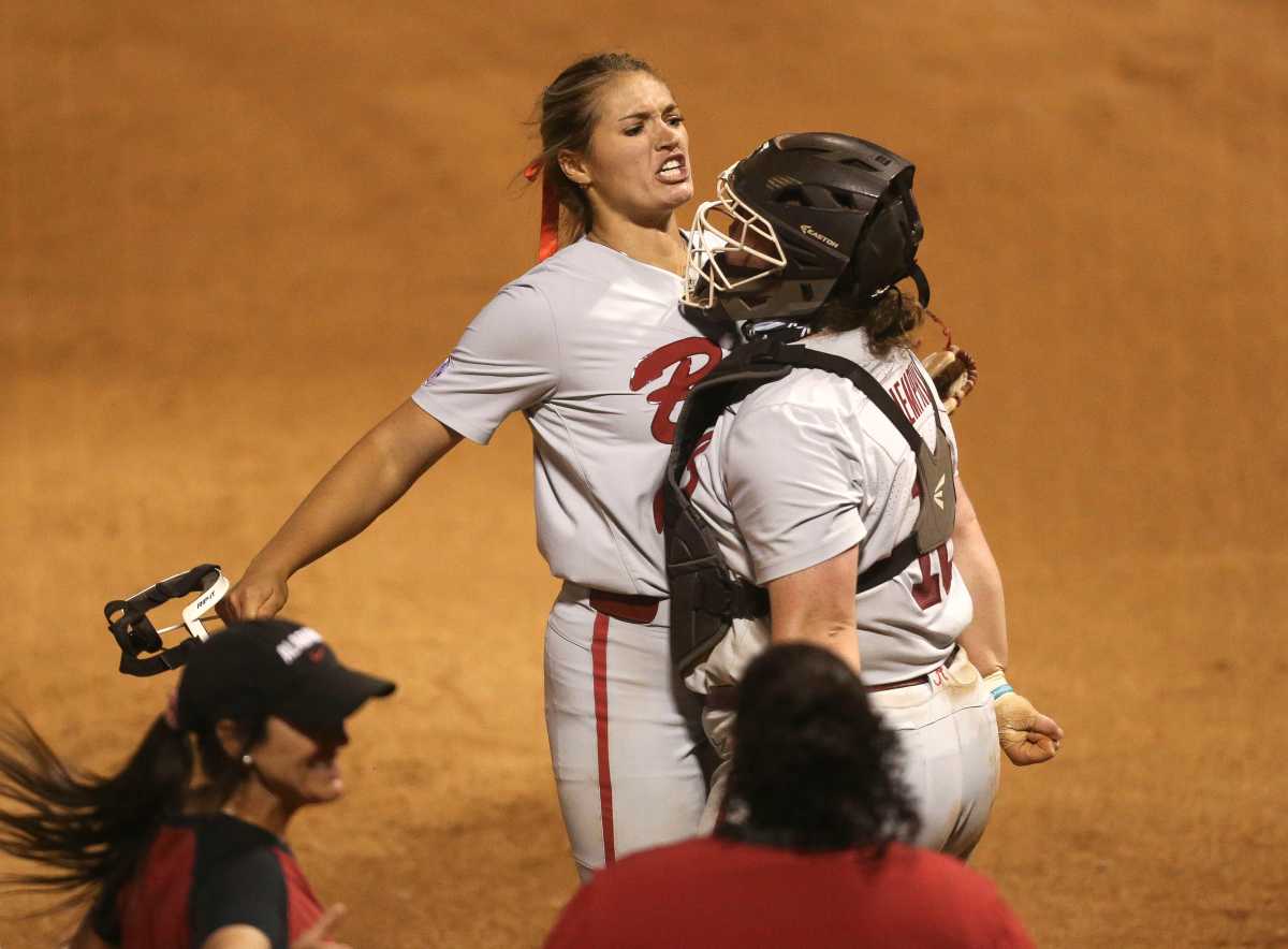 Alabama pitcher Montana Fouts (14) chest bumps with Alabama catcher Bailey Hemphill (16) after the Tide defeated Tennessee 6-5 in the SEC Tournament in Rhoads Stadium Friday, May 14, 2021