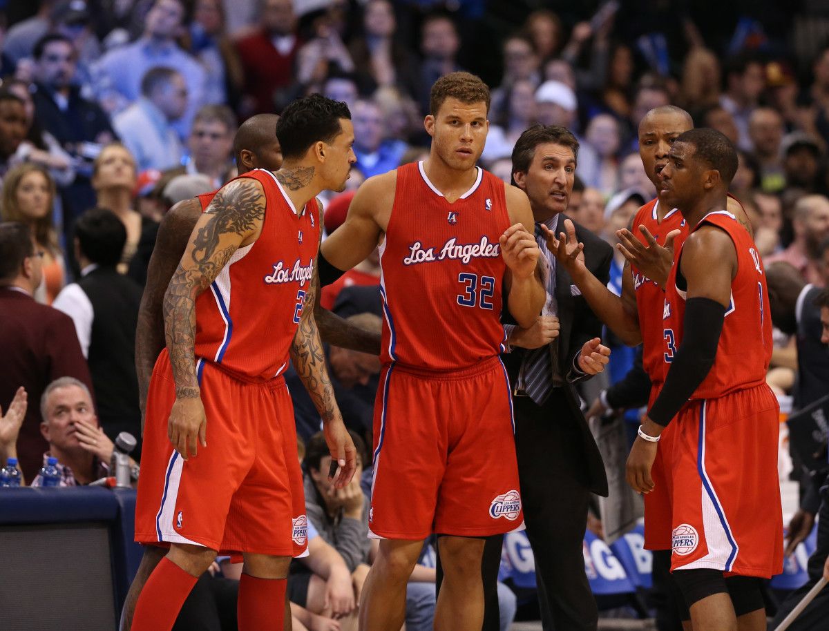 Los Angeles Clippers forward Blake Griffin (32) talks with teammates Caron Butler (5) Chris Paul (3) and Matt Barnes (22) with head coach Vinny Del Negro against the Dallas Mavericks at the American Airlines Center. The Mavs beat the Clippers 109-102. in overtime.