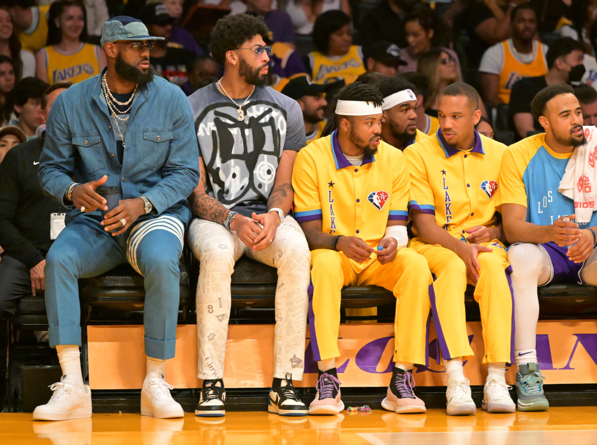 Los Angeles Lakers forward LeBron James (6) sits with forward Anthony Davis (3) along with forward Kent Bazemore (9) and guard Avery Bradley (20) on the bench during the game against the Oklahoma City Thunder at Crypto.com Arena.