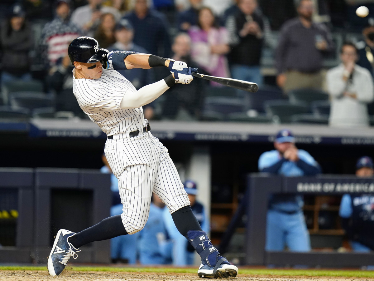 New York Yankees’ Aaron Judge hits a three-run home run during the ninth inning of a baseball game against the Toronto Blue Jays Tuesday, May 10, 2022, in New York. The Yankees won 6-5.