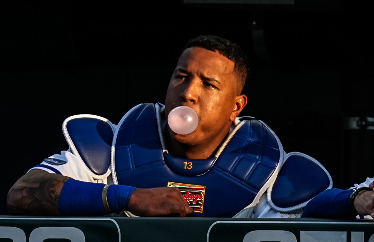May 16, 2022; Kansas City, Missouri, USA; Kansas City Royals catcher Salvador Perez (13) blows a bubble in the dugout during the second inning against the Chicago White Sox at Kauffman Stadium. Mandatory Credit: Jay Biggerstaff-USA TODAY Sports