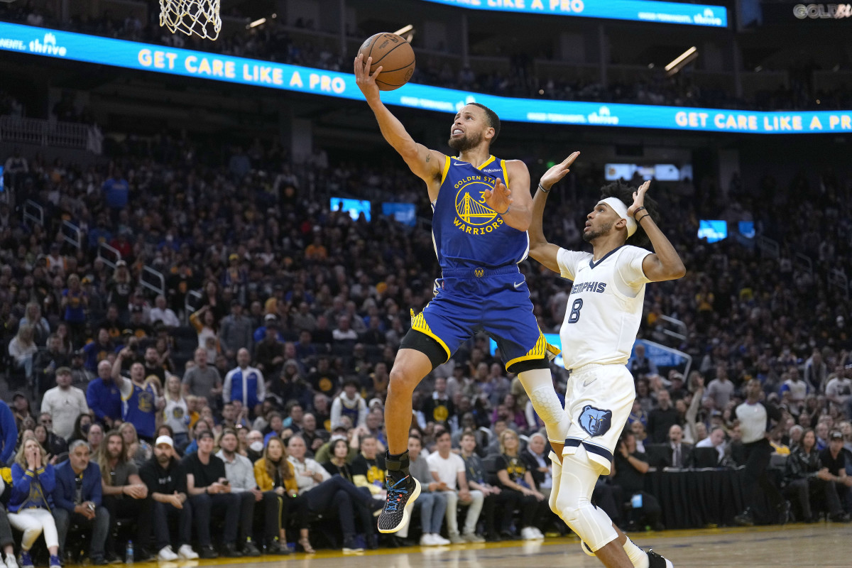 Golden State Warriors guard Stephen Curry (30) drives to the basket past Memphis Grizzlies guard Ziaire Williams (8) during the first half of Game 6 of an NBA basketball Western Conference playoff semifinal in San Francisco, Friday, May 13, 2022.