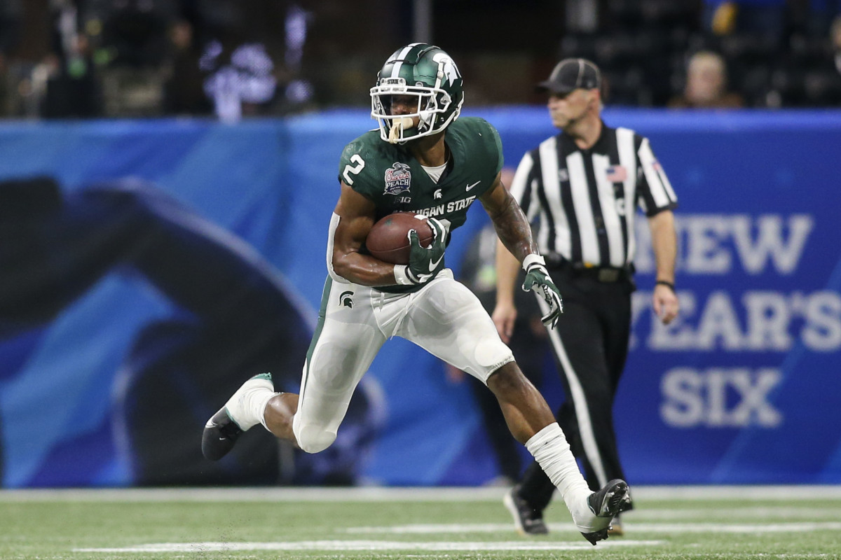 Dec 30, 2021; Atlanta, GA, USA; Michigan State Spartans running back Harold Joiner (2) runs the ball against the Pittsburgh Panthers in the second half during the 2021 Peach Bowl at Mercedes-Benz Stadium. Mandatory Credit: Brett Davis-USA TODAY Sports