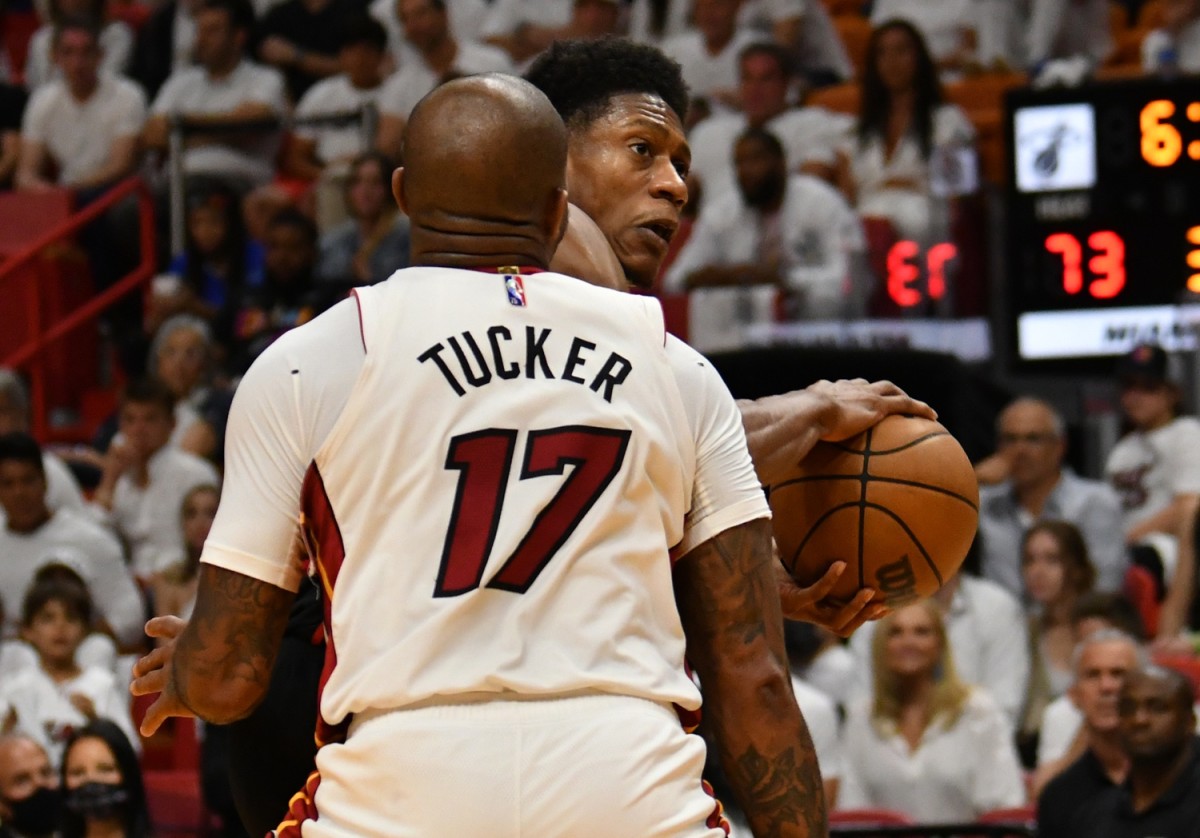 Atlanta Hawks forward De'Andre Hunter (12) is defended by Miami Heat forward P.J. Tucker (17) during the second half of game one of the first round for the 2022 NBA playoffs at FTX Arena.