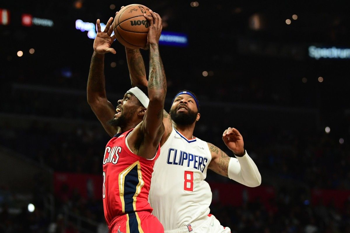 Los Angeles Clippers forward Marcus Morris Sr. (8) blocks the shot of New Orleans Pelicans forward Naji Marshall (8) during the first half at Crypto.com Arena.
