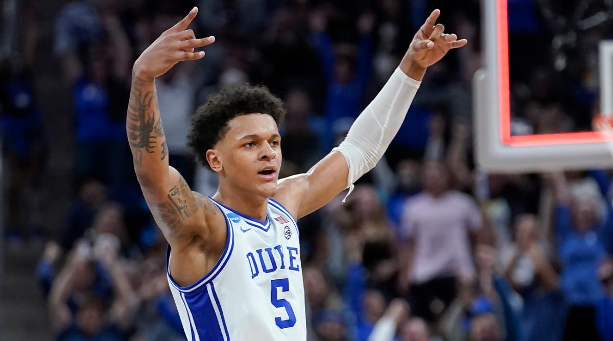 FILE - Duke forward Paolo Banchero celebrates during the first half of a college basketball game against Arkansas in the Elite 8 round of the NCAA men’s tournament in San Francisco, Saturday, March 26, 2022. Houston, Detroit and Orlando share the best odds to win the draft lottery on Tuesday, May 17, 2022, and the No. 1 pick in the NBA draft. All three are already loaded with young players, even before the possibility of adding someone like Chet Holmgren, Paolo Banchero or Jabari Smith.