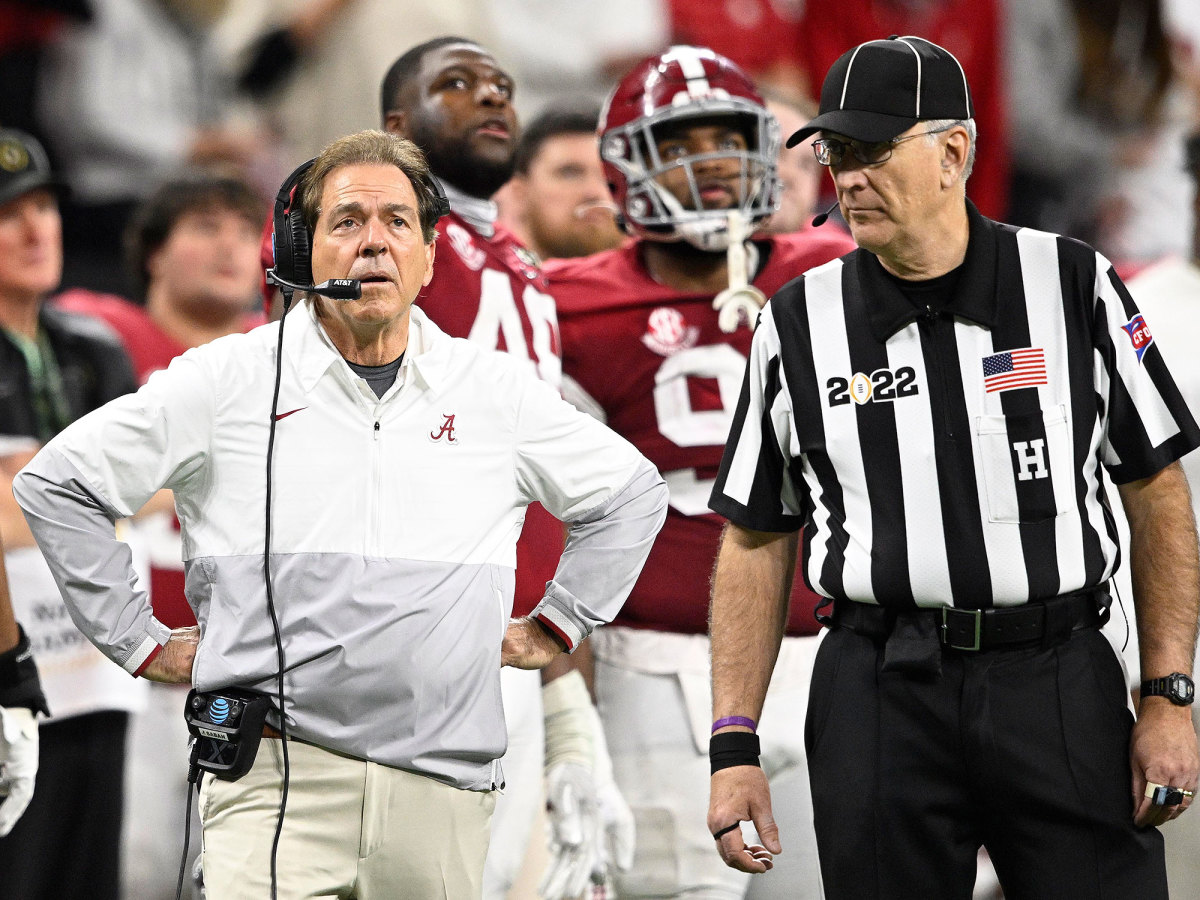 Alabama coach Nick Saban alongside a referee