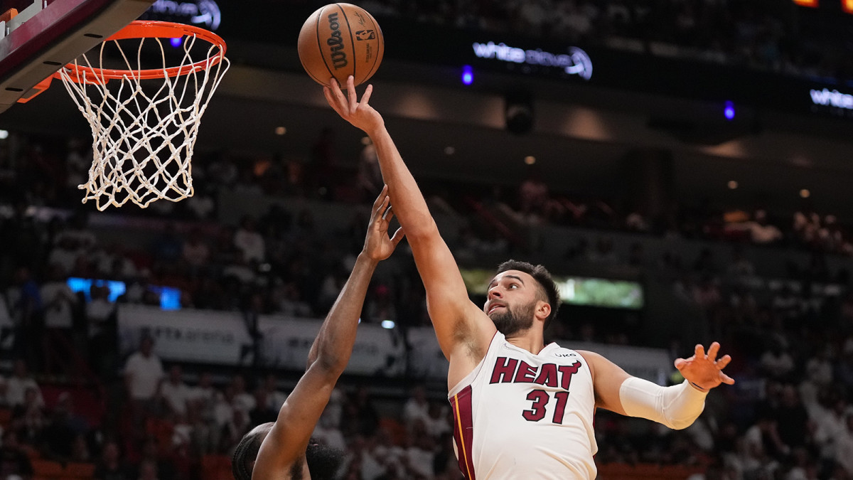 Miami Heat guard Max Strus (31) puts up a shot over Philadelphia 76ers guard James Harden.