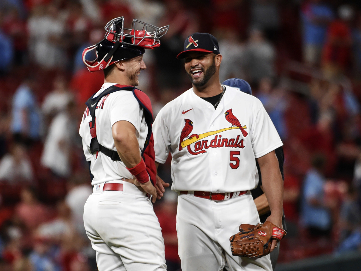 St. Louis Cardinals catcher Andrew Knizner (7) and teammate Albert Pujols celebrate their team’s 15-6 victory over the San Francisco Giants after a baseball game on Sunday, May 15, 2022, in St. Louis.