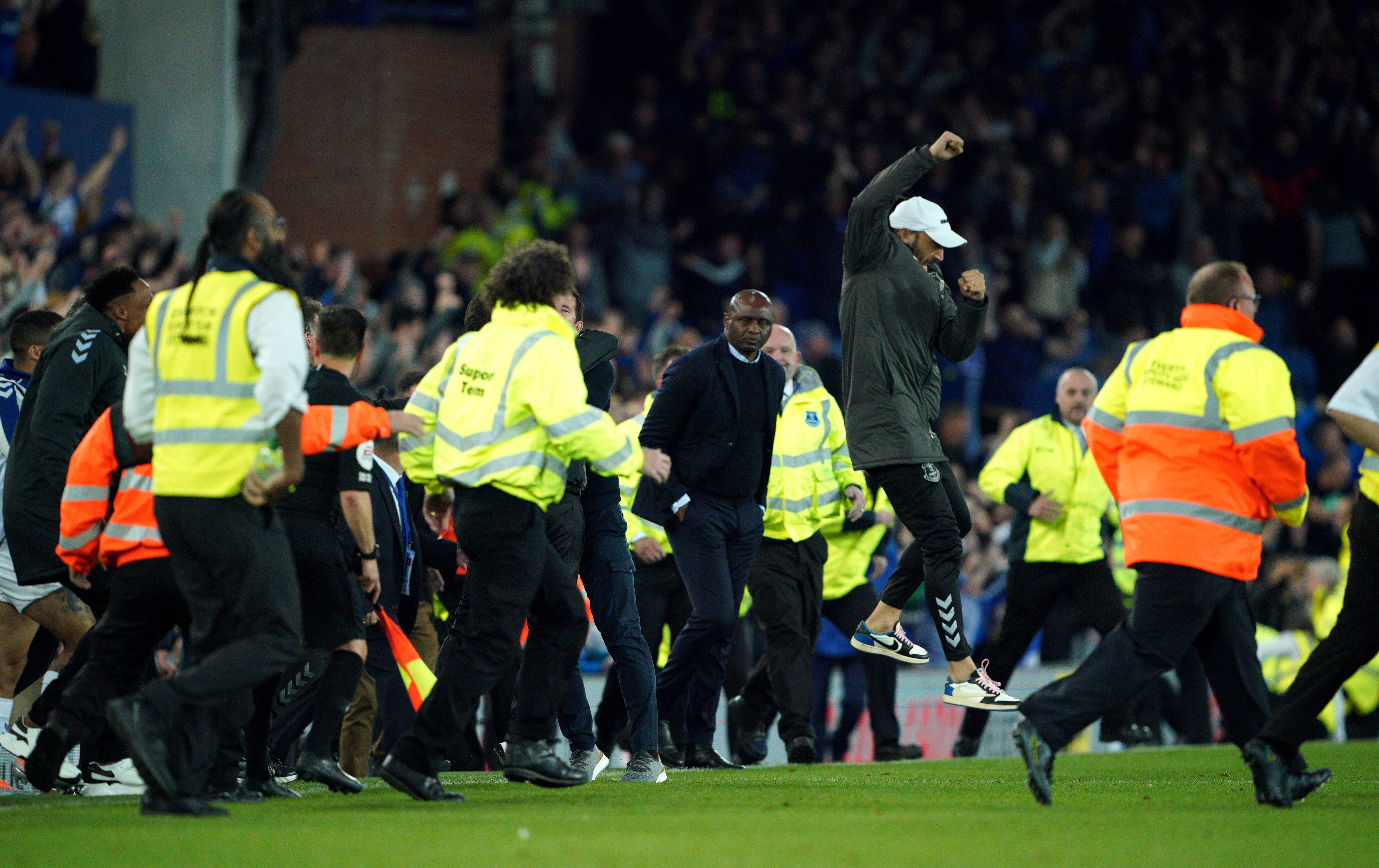 Crystal Palace manager Patrick Vieira pictured (center) at Goodison Park before thousands of Everton fans rushed the field after their side's 3-2 win in May 2022
