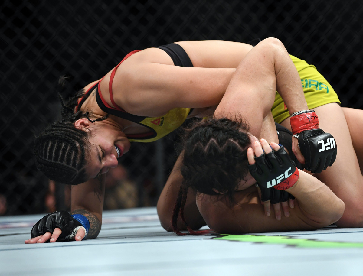 Ketlen Vieira pins Cat Zingano to the mat during UFC 222.