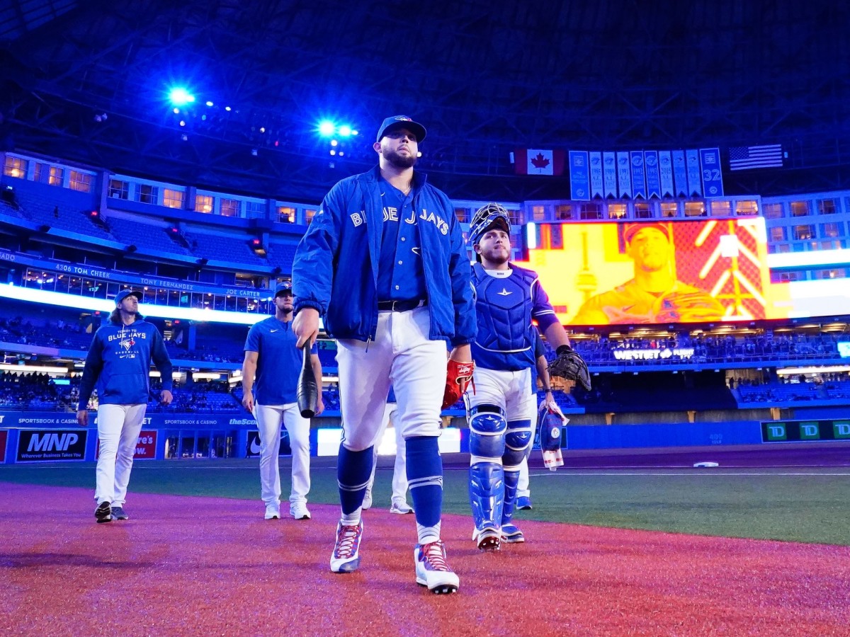 May 3, 2022; Toronto, Ontario, CAN; Toronto Blue Jays pitcher Alek Manoah (center) and catcher Alejandro Kirk (right) head to the dugout before a game against the New York Yankees at Rogers Centre.