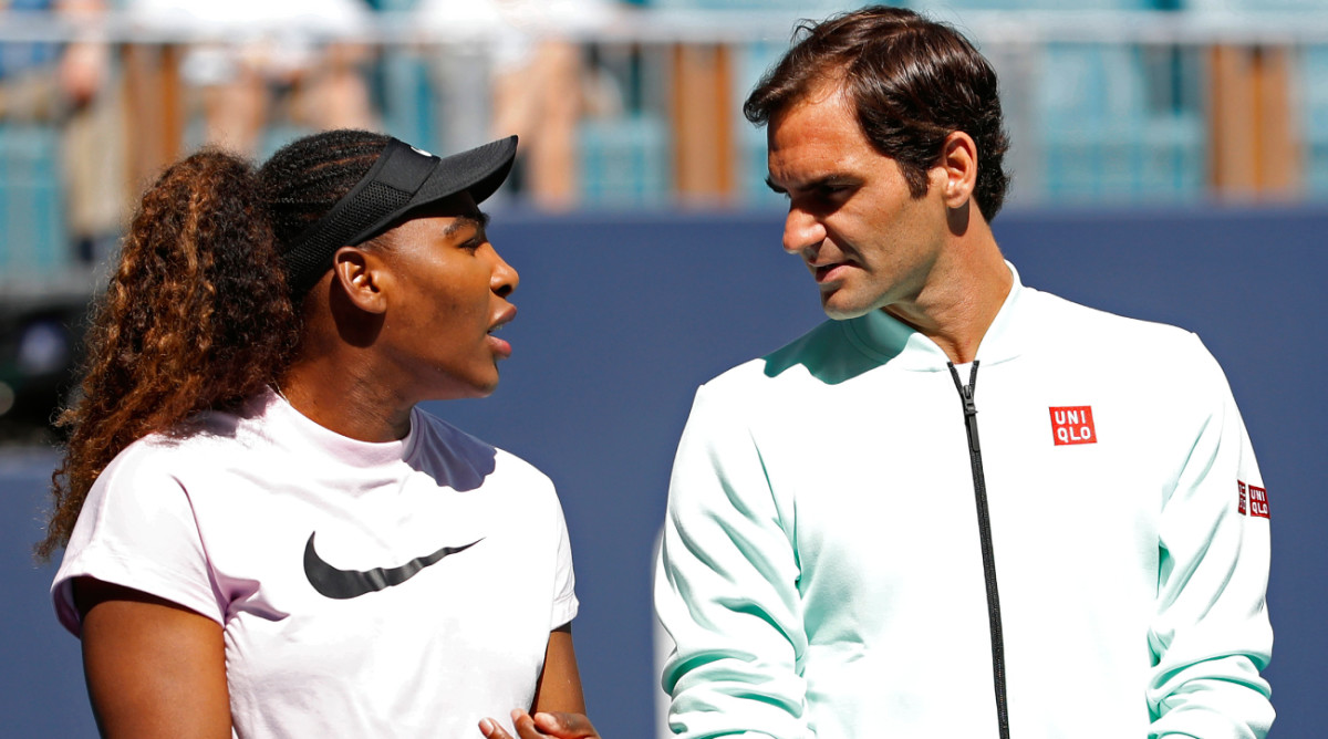 Serena Williams of the United States (L) speaks with Roger Federer of Switzerland (R) during a ribbon cutting ceremony.
