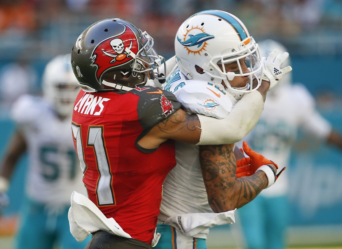 Nov 19, 2017; Tampa Bay Buccaneers safety Justin Evans (21) tackles Miami Dolphins receiver Kenny Stills (10). Mandatory Credit: Reinhold Matay-USA TODAY Sports