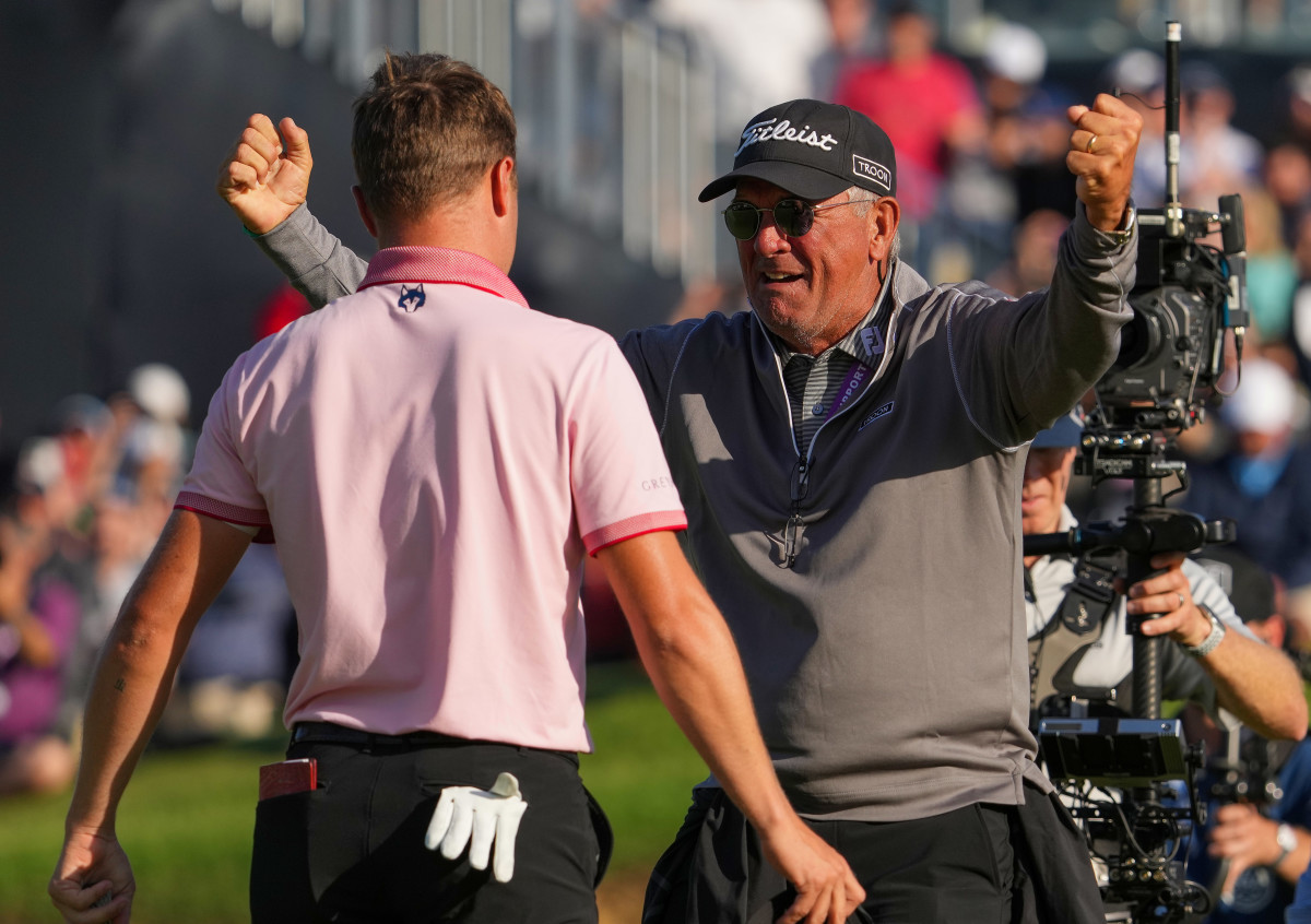 Justin Thomas (left) and his dad Mike Thomas celebrate after winning the PGA Championship golf tournament in a three hole playoff.