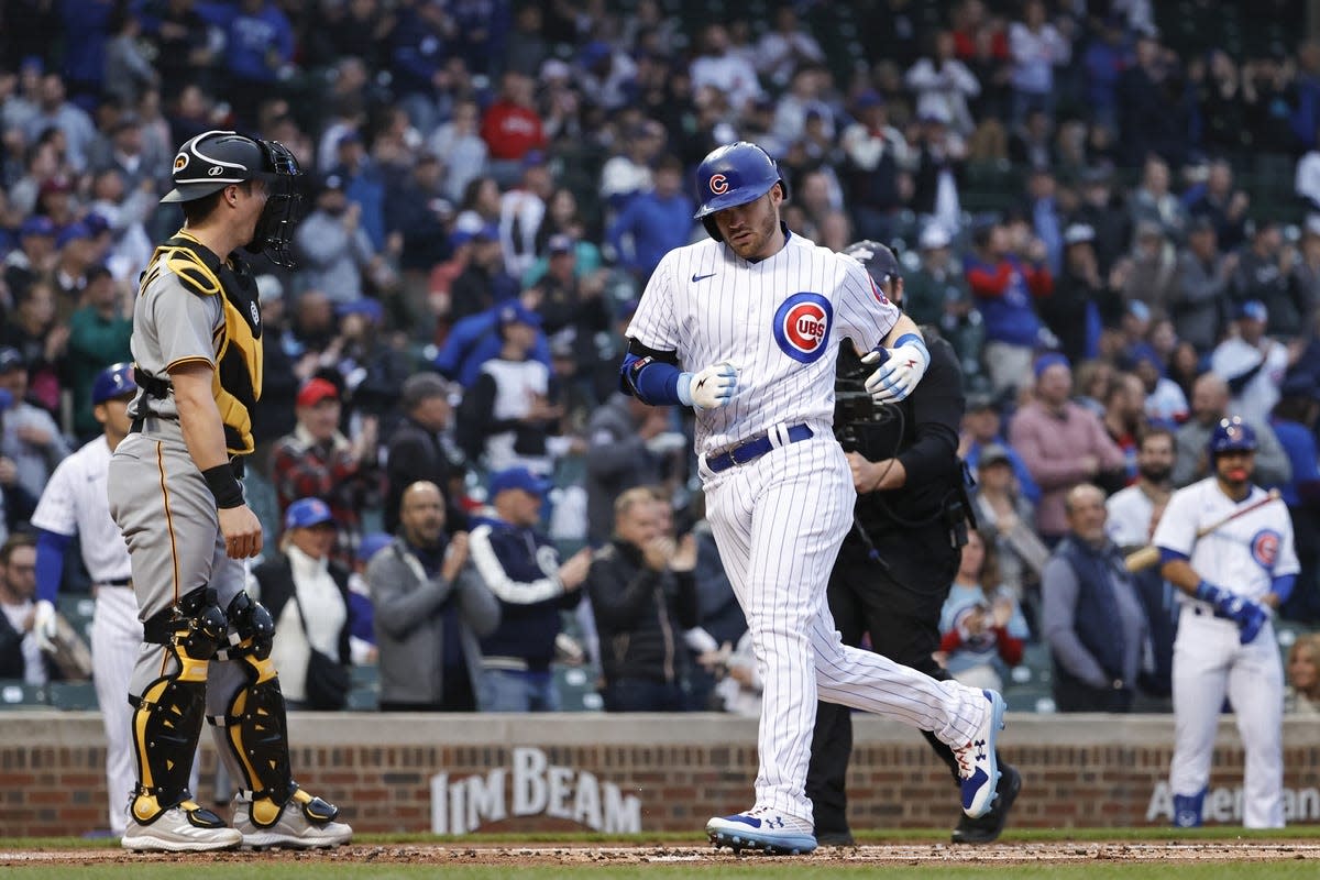May 18, 2022; Chicago, Illinois, USA; Chicago Cubs center fielder Ian Happ (8) crosses home plate after hitting a solo home run against the Pittsburgh Pirates during the first inning at Wrigley Field. Mandatory Credit: Kamil Krzaczynski-USA TODAY Sports