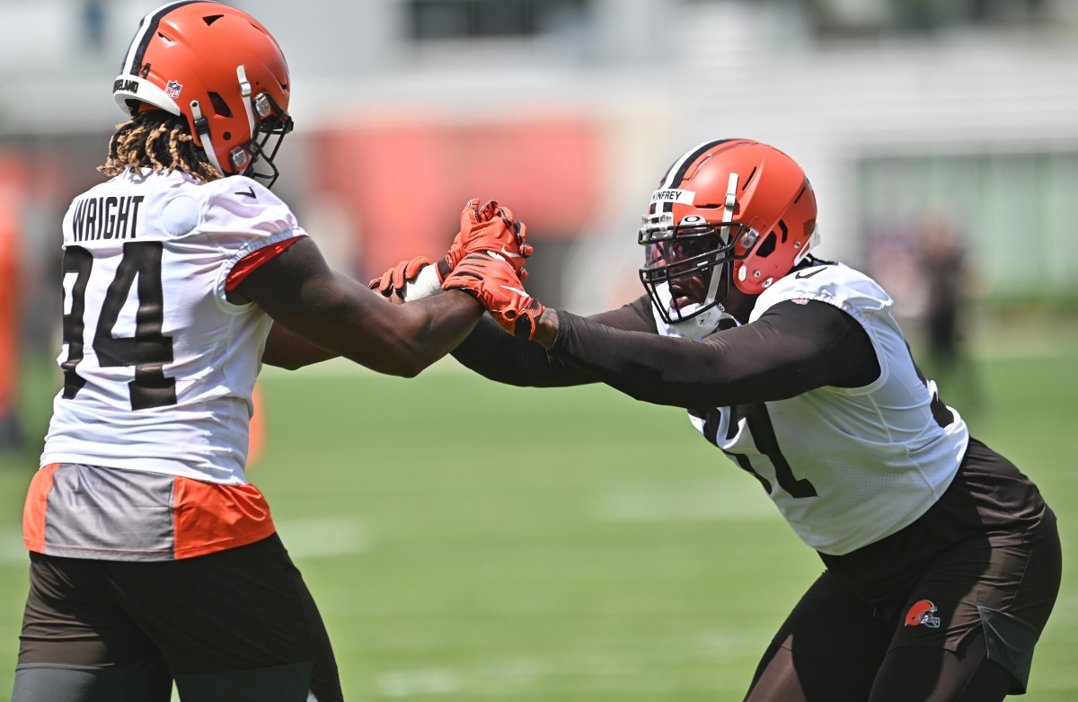 May 13, 2022; Berea, OH, USA; Cleveland Browns defensive end Alex Wright (94) and defensive tackle Perrion Winfrey (97) run a drill during rookie minicamp at CrossCountry Mortgage Campus. Mandatory Credit: Ken Blaze-USA TODAY Sports