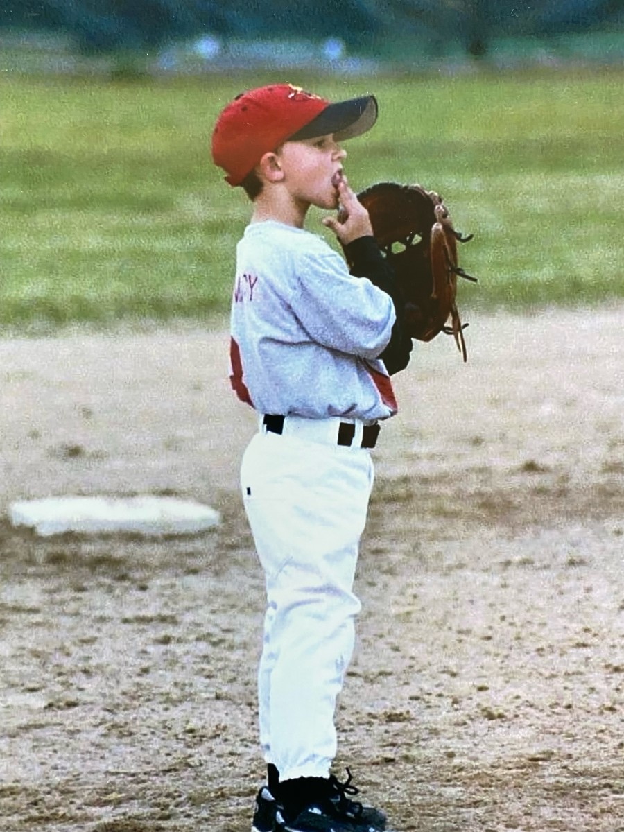 Young J.T. Jarrett playing baseball.