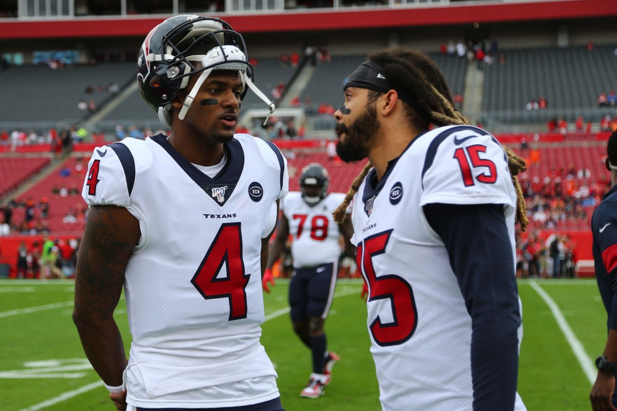 Dec 21, 2019; Tampa, Florida, USA; Houston Texans quarterback Deshaun Watson (4) and wide receiver Will Fuller (15) talk against the Tampa Bay Buccaneers prior to the game at Raymond James Stadium. Mandatory Credit: Kim Klement-USA TODAY Sports