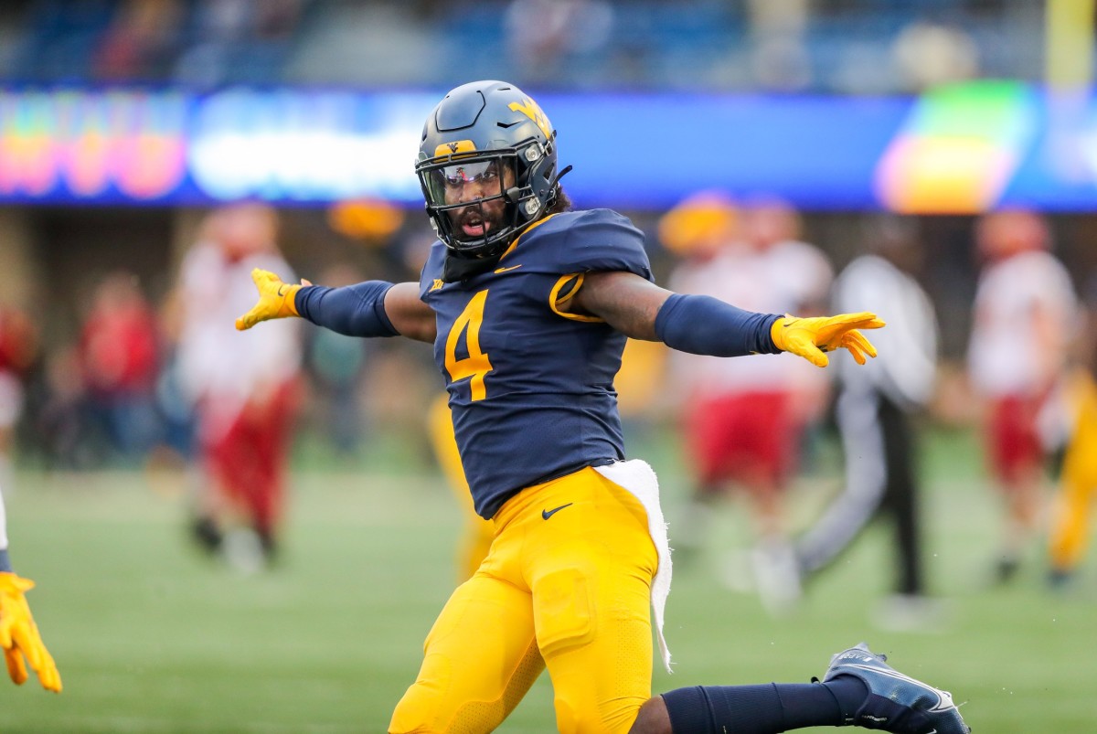 Oct 30, 2021; Morgantown, West Virginia, USA; West Virginia Mountaineers safety Alonzo Addae (4) celebrates a defensive stop during the fourth quarter against the Iowa State Cyclones at Mountaineer Field at Milan Puskar Stadium.