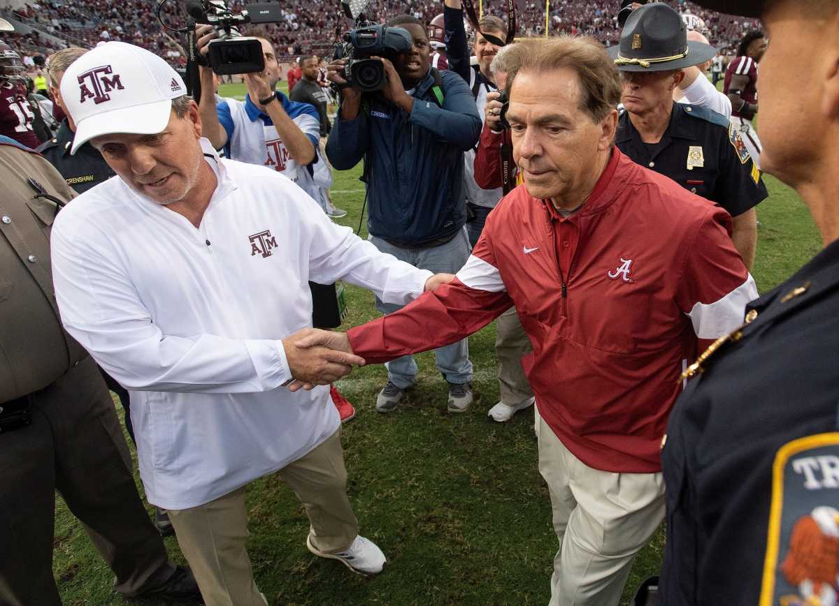 Texas A&M coach Jimbo Fisher and Alabama coach Nick Saban shake hands at midfield after their game at Kyle Field in College Station, Texas, on Saturday, Oct. 12, 2019.