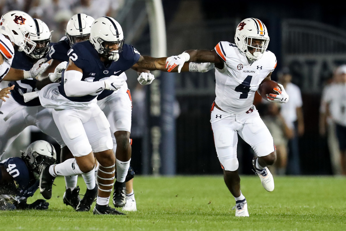 Sep 18, 2021; University Park, Pennsylvania, USA; Auburn Tigers running back Tank Bigsby (4) runs the ball against the Penn State Nittany Lions during the first quarter at Beaver Stadium. Mandatory Credit: Matthew OHaren-USA TODAY Sports