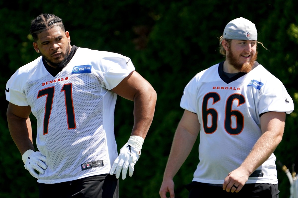 Cincinnati Bengals offensive tackle La'el Collins (71) and offensive guard Alex Cappa (66) wait their turn for a drill during practice, Tuesday, May 17, 2022, at the Paul Brown Stadium practice fields in Cincinnati. Cincinnati Bengals Practice May 17 0097