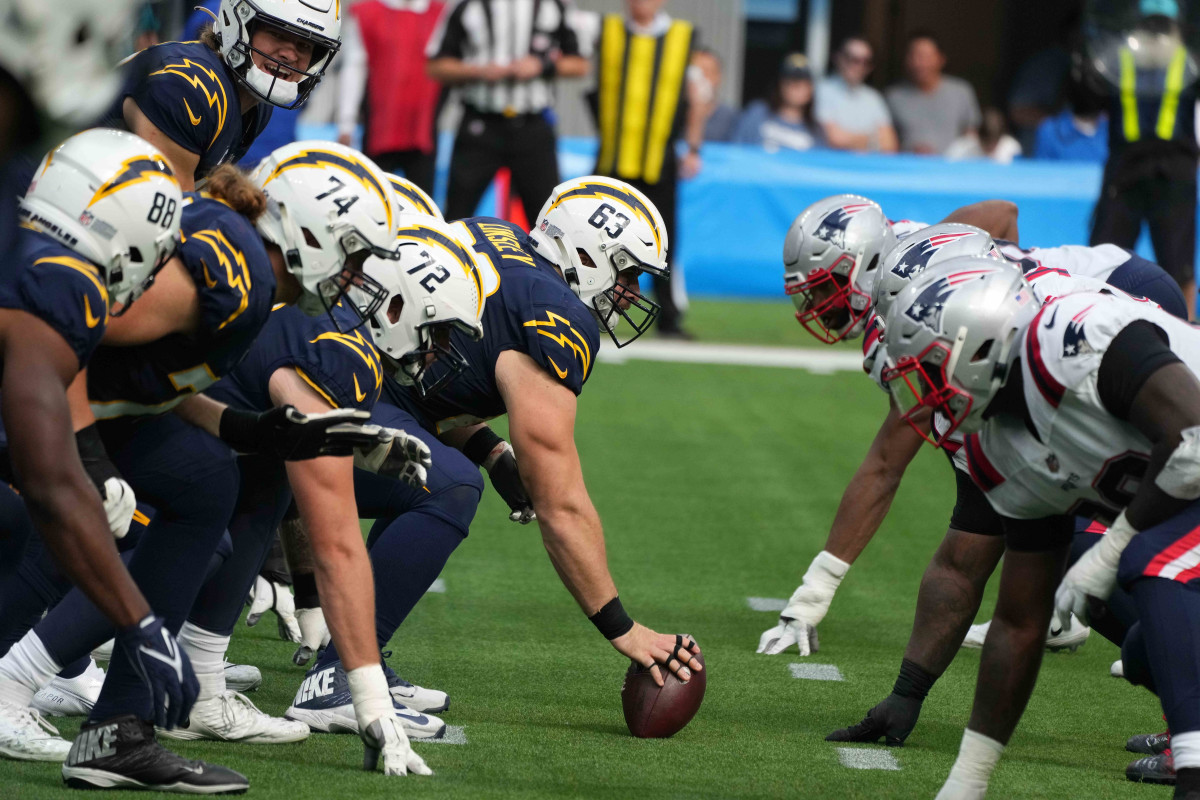 Oct 31, 2021; Inglewood, California, USA; A general overall view of the line of scrimmage as Los Angeles Chargers center Corey Linsley (63) snaps the ball against the New England Patriots at SoFi Stadium. The Patriots defeated the Chargers 27-24. Mandatory Credit: Kirby Lee-USA TODAY Sports