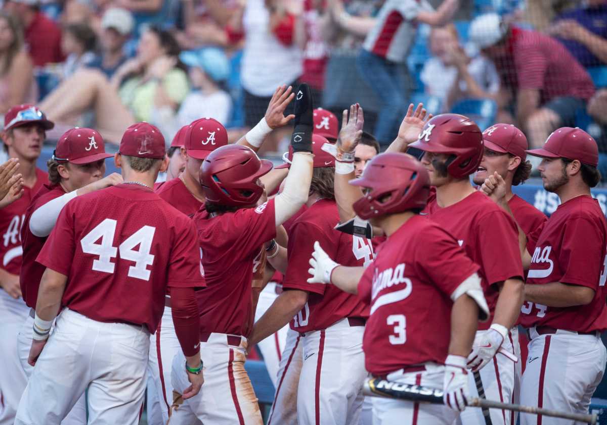 Alabama utility player Caden Rose (7) celebrates after scoring a run as Alabama Crimson Tide takes on Texas A&M Aggies during the SEC baseball tournament at the Hoover Metropolitan Stadium in Hoover, Ala., on Friday, May 27, 2022.